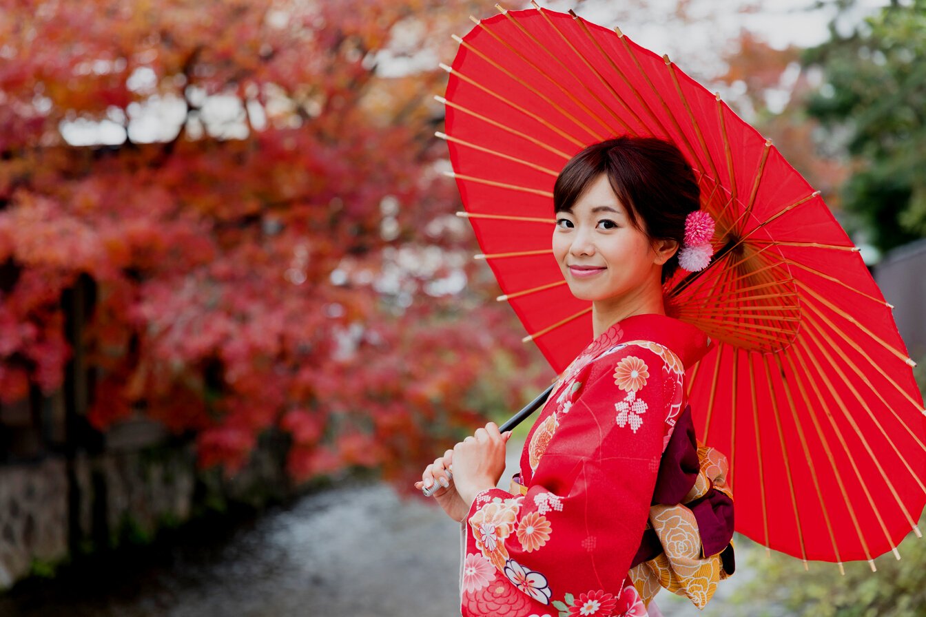 attractive asian woman wearing kimono in autumn